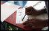 One fourth grader from a local Fairfax County public school tries to write with a quill pen during during a Constitution Day 2005 celebration at George Washington's Mount Vernon Estate Friday, September 16, 2005. Lynne Cheney hosted the celebration which marks the 218th anniversary of the signing of the U.S. Constitution. 