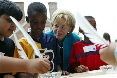 Gunston Elementary School students Aqial Ahmed, left, Abel Aklilu, center, and Abrham Meagistu practice their penmanship using quill pens at Gunston Hall Plantation, the historic home of Founding Father George Mason, Friday, Sept. 17, 2004. Lynne Cheney hosted 200 third grade students from schools in Northern Virginia for Constitution Day, an annual interactive program designed to educate students on America's history through Constitution-era games and activities. 