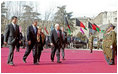 Prior to the inauguration of Afghanistan President Hamid Karzai, Vice President Dick Cheney and his wife, Lynne, and U.S. Ambassador to Afghanistan Zalmay Khalilzad, second on left, attend a welcoming ceremony at the Presidential Palace in Kabul, Afghanistan, Dec. 7, 2004.