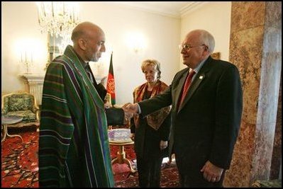 Vice President Dick Cheney shakes hands with newly-elected President Hamid Karzai of Afghanistan before departing Kabul, Afghanistan, Dec. 7, 2004. Vice President Dick Cheney and Lynne Cheney flew to Afghanistan to attend the historic swearing-in ceremony of President Karzai.