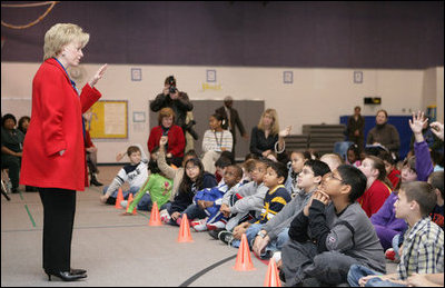 Students at Fort Belvoir Elementary School fill the gymnasium Tuesday, Dec. 13, 2005, for a visit by Mrs. Lynne Cheney. Mrs. Cheney spoke with the kids about the importance of the upcoming Iraqi elections and likened the parliamentary procedure to that of America's in its own early struggle for democracy.