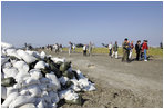 Vice President Dick Cheney and Mrs. Cheney tour the 17th Street levee repair operations in New Orleans, Louisiana during a recent visit to survey damage and relief efforts in the wake of Hurricane Katrina September, 8, 2005.