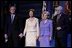 President George W. Bush stands with Laura Bush, Lynne Cheney and Vice President Dick Cheney during the pre-inaugural event “Saluting Those Who Serve” at the MCI Center in Washington, D.C., Tuesday Jan. 18, 2005.