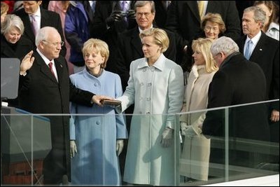 Dick Cheney is sworn in for a second term as Vice President by Speaker of the House of Representatives Dennis Hastert during an inaugural ceremony Thursday, Jan. 20, 2005. Lynne Cheney, Mary Cheney, and Liz Cheney listen as he takes the oath of office at the U.S. Capitol.White House photo by Susan Sterner 