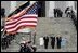 Escorted by Army Major General Galen Jackman, center, President George W. Bush, Laura Bush, Vice President Dick Cheney and Lynne Cheney salute the American flag from the U.S. Capitol steps before President Bush takes the oath of office for a second term as the 43rd President of the United States, Thursday, January 20, 2005.White House photo by Eric Draper 