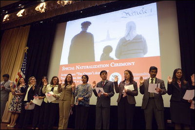 American citizens are sworn in during a special naturalization ceremony at the National Archives Tuesday, April 17, 2007, in Washington, D.C. Mrs. Cheney addressed the new citizens and presented each one with a copy of, “The Citizen’s Almanac,” a new book that highlights some of the most important historical symbols, decisions and documents in America’s history. White House photo by Lynden Steele