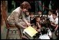 Laura Bush reads to a group of second-graders in the library of Morningside Elementary School in San Fernando, Calif., March 22, 2001. White House photo by Paul Morse.