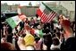 Laura Bush and Mexican President Vicente Fox are greeted by cheering students as they arrive to Morningside Elementary School in San Fernando, Calif., March 22, 2001. White House photo by Paul Morse.