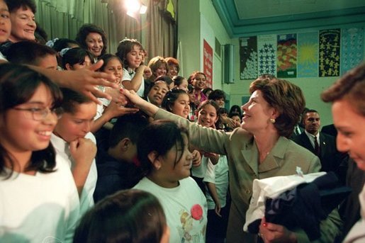 Laura Bush greets student of Morningside Elementary School after addressing the assembly in San Fernando, Calif., March 22, 2001. White House photo by Paul Morse.