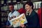 Laura Bush and Baltimore Orioles shortstop, Mike Bordick, read to children at the Washington, D.C. Public Library, Northeast Branch, as part of “Celebrate National Library Week at your Library” April 3, 2001. White House photo by Eric Draper.