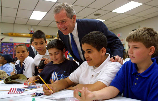 President George W. Bush talks with students at B.W. Tinker School in Waterbury, Connecticut on April 18, 2001.