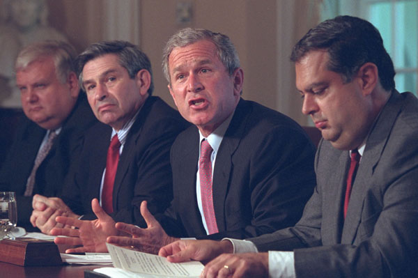 President George W. Bush speaks to reporters during an Energy Meeting in Cabinet Room Thursday, May 3, flanked by Energy Secretary Spencer Abraham, right, and Deputy Defense Secretary Paul Wolfowitz WHITE HOUSE PHOTO BY ERIC DRAPER