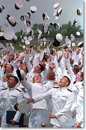 Graduates complete the traditional hat toss. WHITE HOUSE PHOTO BY PAUL MORSE