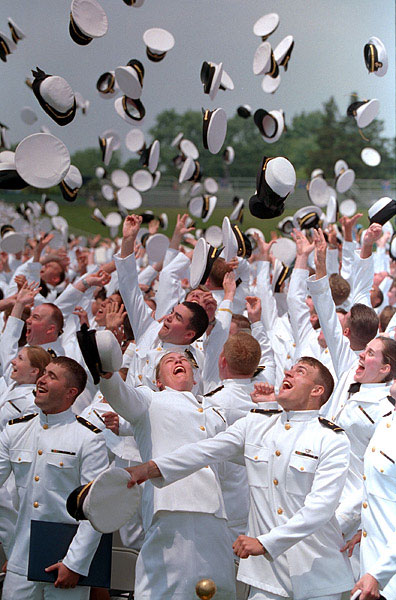 Graduates complete the traditional hat toss. WHITE HOUSE PHOTO BY PAUL MORSE