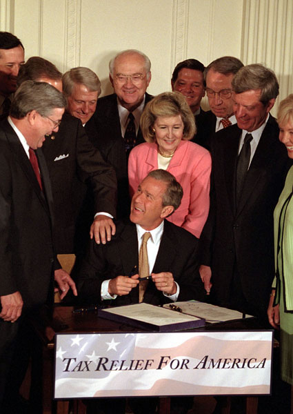 President George W. Bush signs the tax bill on Thursday, June 7 in the White House.