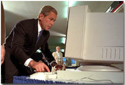 President George W. Bush tries out a computer at the Pentagon's Computer/Electronic Accommodations Program, which helps people with disabilities work and communicate better. WHITE HOUSE PHOTO BY PAUL MORSE