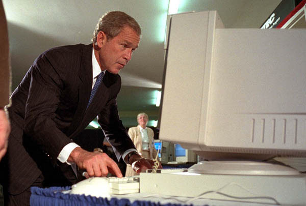 President George W. Bush tries out a computer at the Pentagon's Computer/Electronic Accommodations Program, which helps people with disabilities work and communicate better. WHITE HOUSE PHOTO BY PAUL MORSE