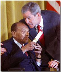 President George W. Bush honors music legend Lionel Hampton during a ceremony recognizing Black Music Month in the East Room of the White House on June 30, 2001. WHITE HOUSE PHOTO BY PAUL MORSE