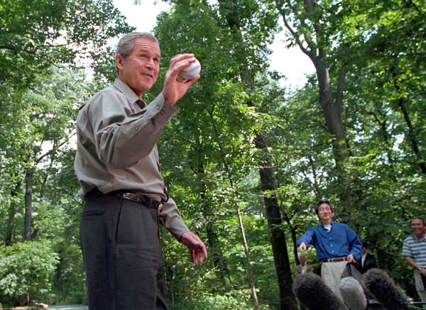 President Bush and Prime Minister Koizumi of Japan toss around a baseball for the press during a visit to Camp David June 30, 2001.