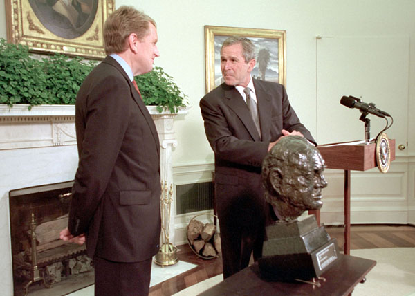 President Bush accepts a bust of Sir Winston Churchill from ambassador of England, Sir Christopher Meyer July 16, 2001. "He was a man of great courage. He knew what he believed. And he really kind of went after it in a way that seemed like a Texan to me," said the President explaining why he would like the likeness of an Englishman placed inside the Oval Offfice. "He charged ahead, and the world is better for it.". White House photo by Paul Morse.