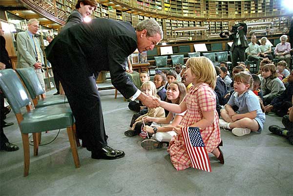 Welcomed by leaders both tall and small, President Bush and First Lady Laura Bush visit the reading room at the British Museum July 19, 2001. White House photo by Eric Draper.