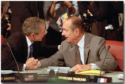 President Bush and President Chirac of France talk over issues during the G-8 sessions, July 21, 2001. White House photo by Paul Morse.