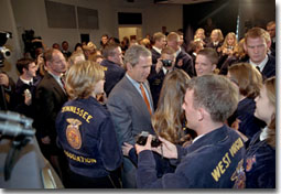 Tilling it up with members of Future Farmers of America, President Bush wades into an enthusiastic crowd after addressing 100 representatives the Friday, July 27, 2001. White House photo by Eric Draper.