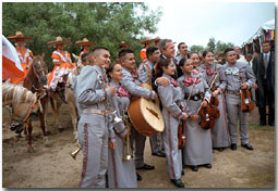 President Bush poses for photos with a mariachi band during the dedication ceremony of the San Antonio Missions National Historical Park in San Antonio, Texas, Aug. 29. White House photo by Moreen Ishikawa.