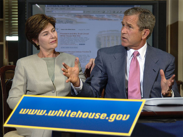 Guided by White House Webmaster Jane Cook (not pictured), President Bush and Laura Bush tour through the new, restructured White House website in the historic Dwight D. Eisenhower Executive Office Building Library Aug. 31. The new site is more accessible for the disabled community, photo essays, a Spanish section and a kids' page. White House photo by Eric Draper.