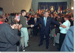 Greeted by applause and cheers, President Bush visits with CIA employees during a trip their headquarters Sept. 26. White House photo by Eric Draper.