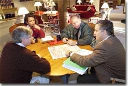 President George W. Bush receives a briefing during a meeting with CIA Director George Tenent, right, National Security Advisor Condoleezza Rice, and Chief of Staff Andy Card at Camp David, Saturday, Sept. 29, 2001. White House photo by Eric Draper.