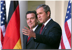 White House photo by Paul Morse. President George Bush and Germany's Chancellor Gerhard Schroeder address the media from the White House steps in the Rose Garden Oct 9.