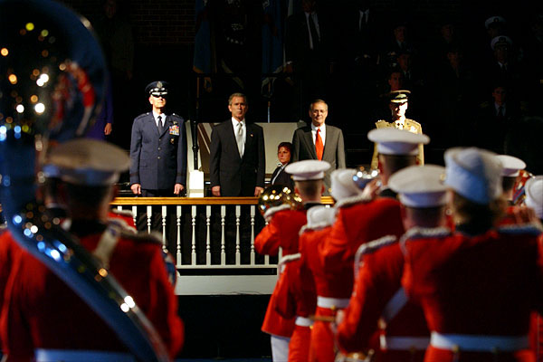 With Secretary of Defense Donald Rumsfeld at his side, President George W. Bush presides over the welcoming ceremony for the incoming Chairman, Gen. Richard B Myers (left), and Vice-Chairman, Gen. Pete Pace (right), of the Joint Chief of Staffs at Fort Meyers Oct. 15. White House photo by Tina Hager.