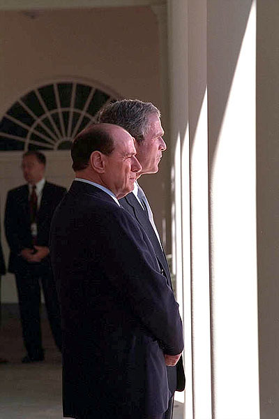 President George Bush and Italy's Prime Minister Silvio Berlusconi talk on the colonnade outside of the Oval Office Oct. 15. White House photo by Tina Hager.