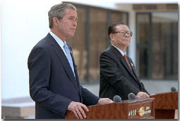 President George W. Bush and Chinese President Jiang Zemin deliver a joint statement to the media in Shanghai, People's Republic of China, Oct. 19. White House photo by Eric Draper.