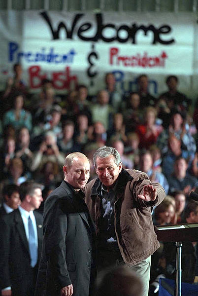 President George W. Bush and Russian President Vladimir Putin answer questions from students at Crawford High School Nov. 15. "When I was in high school, Russia was an enemy," said President Bush. "Now the high school students can know Russia as a friend; that we're working together to break the old ties, to establish a new spirit of cooperation and trust so that we can work together to make the world more peaceful.". White House photo by Paul Morse.