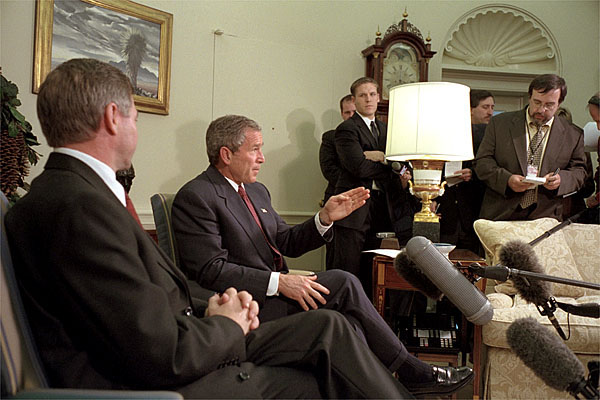 Addressing the media, President George W. Bush meets with Norwegian Prime Minister Kjell Magne Bondevik in the Oval Office of the White House, December 5, 2001. "We won't forget what took place," said President Bush, referring to the Sept. 11 terrorist attacks. "And we will bring them to justice." White House photo by Paul Morse.