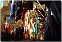 As they lay their hands over their hearts, President George W. Bush and Mrs. Laura Bush listen to the playing of the National Anthem during The World Will Always Remember September 11th Ceremony in the East Room Dec. 11. 