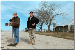 President George W. Bush and Army General Tommy Franks talk with the press in Crawford, Texas, December 28. White House photo by Susan Sterner.