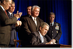 President George W. Bush signs a defense appropriations bill at the Pentagon, Jan., 10. White House photo by Paul Morse.