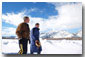 President George W. Bush and friend Roland Betts walk a private trail along the Snake River in Jackson Hole, Wyoming, Saturday, Feb. 9, 2002. The President and Mrs. Bush are staying at the Jackson Hole residence of Roland and Lois Betts. The Grand Teton Mountains are shown in background. White House photo by Eric Draper