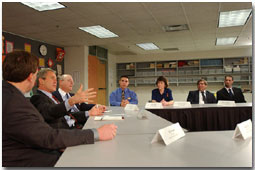 Before addressing the assembled audience and media, President George W. Bush holds a roundtable discussion with educators and students at Eden Prairie High School March 4. Pictured from left to right are Jeff Ireland, Principal of Eden Prairie; Mark Yudof, President of the University of Minnesota; Jesse Tejeda, student at the U of Minn.; Cathy Bockenstedt, science teacher at Central Middle School; Steve Cwodzinski, teacher at Eden Prairie; and Jesse Josephson, teacher at Forest Hills Elementary School. White House photo by Eric Draper.