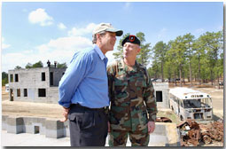 President George W. Bush and Brigadier General Richard Mills, Deputy Commander of U.S. Special Forces, view a tactical demonstration from the roof of a building at Fort Bragg, North Carolina, Friday, March 15, 2002. White House photo by Eric Draper.