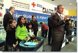 President George W. Bush talks addresses the media during his and Mrs. Bush's visit to Samuel W. Tucker Elementary School in Alexandria, VA, March 20. At the school they announced a partnership to help Afghan children prepare for school. "We want to make sure they've got tablets to write on and crayolas to color with, and even jump ropes to jump with," said the President. ".We've sent 4 million textbooks thus far, and there's another 6 million to go in Afghanistan, so the boys and girls will have something to read."  White House photo by Susan Sterner