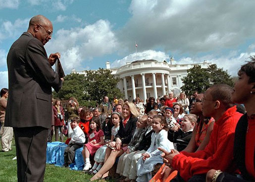 Secretary of Education Roderick Paige reads to children during on of the many story book hours at the Annual Easter Egg Roll on the South Lawn of the White House April 1. Other readers including Laura Bush, Secretary of Transportation Norm Mineta and Marc Brown, children's book author of Arthur Meets the President. White House photo by Evan Parker.