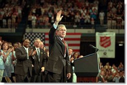 President George W. Bush waves during his visit to the Knoxville Civic Center in Knoxville, Tenn., Monday, April 8. Listing several specific ways Americans can volunteer, the president spoke about the value and need of community service. "And so for those of you out there who are interested in participating, I want you to call up this number, 1-877-USA-CORPS, or to dial up on the Internet, www.citizencorps.gov. This is a way where you can help America," said President Bush. White House photo by Paul Morse.