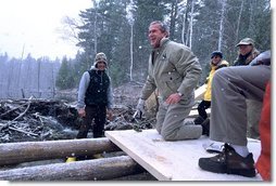 President George W. Bush takes a working tour of The Adirondack Park near Wilmington, NY, Monday, April 22. "We had a great time in the Park, and I want to thank you all very much for giving me the opportunity to hammer and stack, place gravel -- (laughter) -- in a beautiful part of the world. This is quite a sight for a fellow from Texas," said the President in his remarks about Earth Day at Whiteface Mountain Lodge. "We have a duty in our country to make sure our land is preserved, our air is clean, our water is pure, our parks are accessible and open and well- preserved."  White House photo by Eric Draper