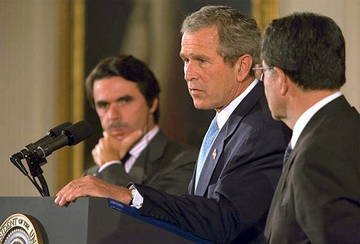 President George W. Bush speaks as European Union President and Spanish Prime Minister Jose Maria Aznar (left) and the European Commission President Romano Prodi listen during a press briefing in the East Room of the White House, Thursday, May 2, 2002. White House photo by Paul Morse.