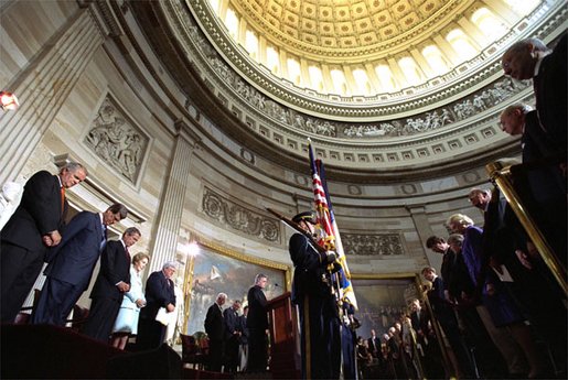 Rev. Daniel P. Coughlin leads the President and guests in prayer at the beginning of the Gold Medal ceremony. "President Reagan believed deeply in American character and destiny," said President Bush. "He believed deeply in the power of freedom to improve the lives of average men and women. These ideas changed America, and they changed the world. Not only because he eloquently explained them, because they are right and they are true." White House photo by Tina Hager.