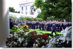 President George W. Bush approached the podium for the presentation ceremony of Commander-in-Chief's Trophy to the Air Force Academy football team in the Rose Garden Friday, May 17. "I'm proud of what this group of Americans have done on the football field. No more proud than those who wear the blue, I might add. And I'm proud of your commitment to our country," said the President in his address. White House photo by Paul Morse.